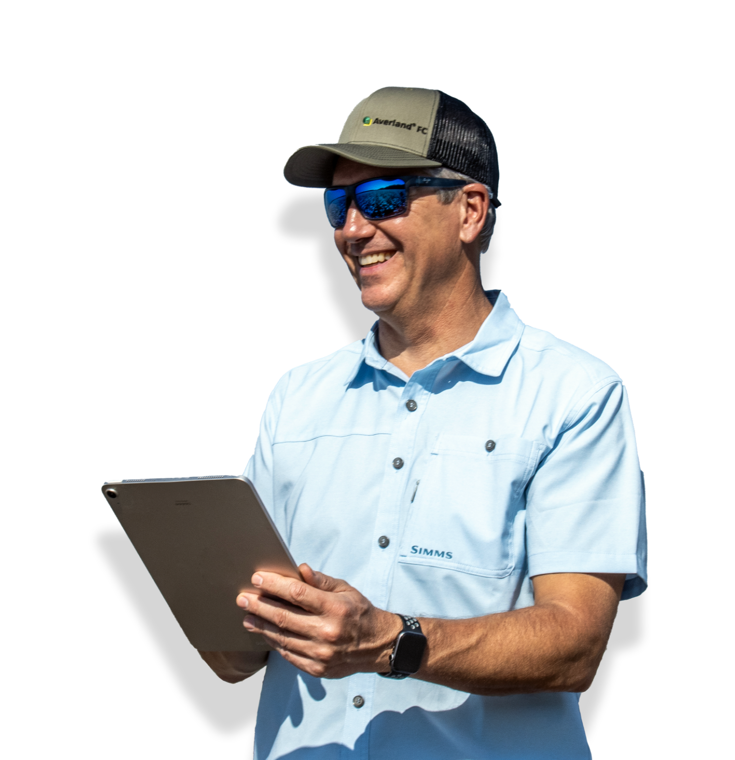 Smiling Greg holding ipad and wearing an Averland FC hat